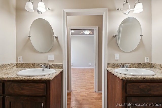 bathroom featuring vanity and hardwood / wood-style floors