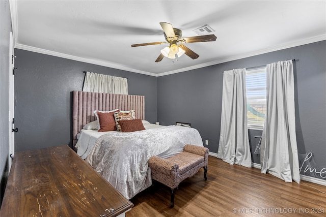 bedroom with ceiling fan, ornamental molding, and hardwood / wood-style flooring