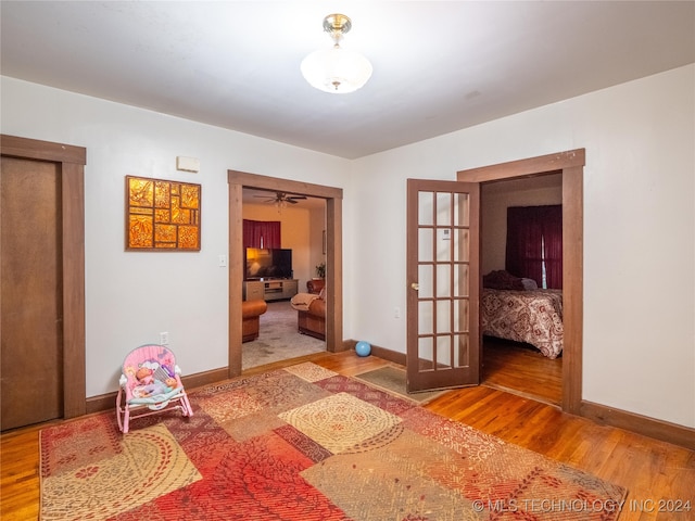 interior space with hardwood / wood-style floors and french doors