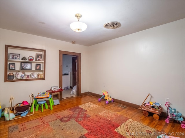 game room with hardwood / wood-style flooring