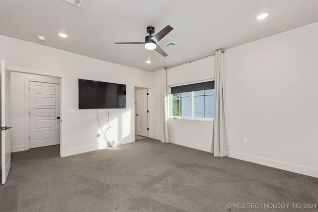 unfurnished bedroom featuring ceiling fan and carpet floors