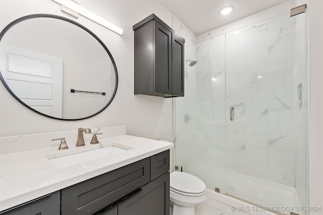 bathroom with vanity, toilet, and walk in shower