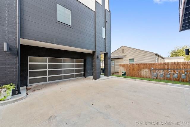 view of property exterior featuring a garage