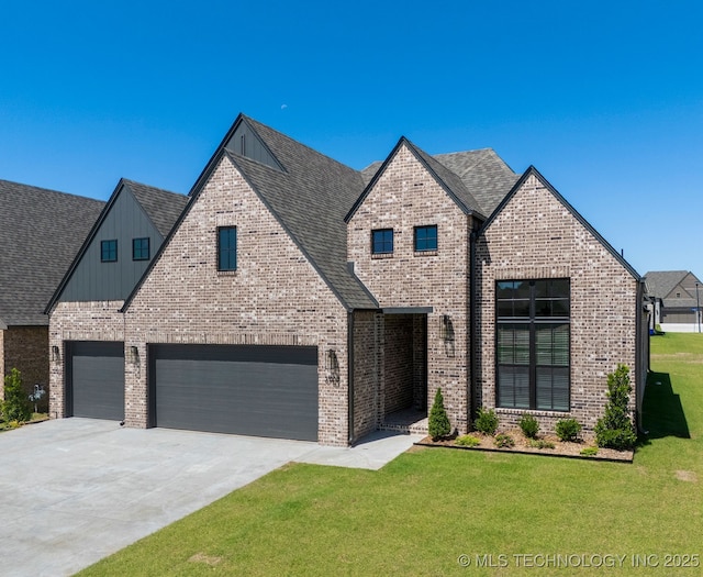 3908 S Elder Blvd, Broken Arrow, OK 74012 - view of front facade with a front lawn, driveway, board and batten siding, brick siding, and an attached garage