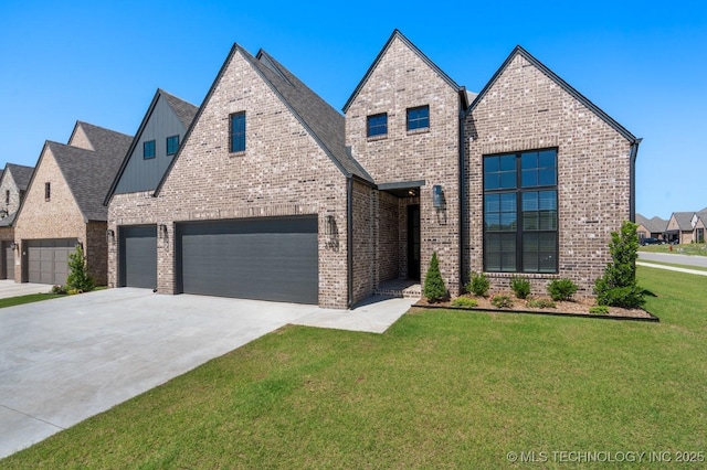 3908 S Elder Blvd, Broken Arrow, OK 74012 - view of front facade featuring a front yard, concrete driveway, brick siding, board and batten siding, and a garage