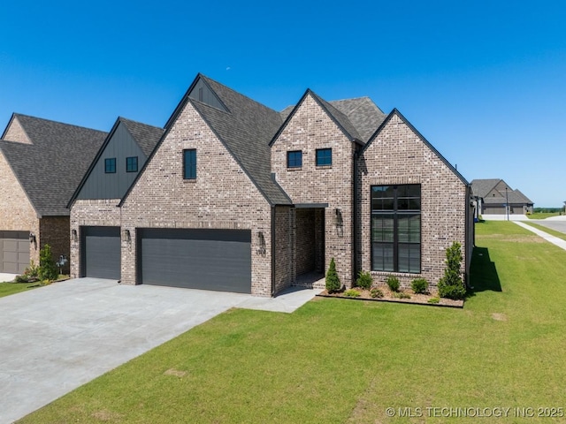 3908 S Elder Blvd, Broken Arrow, OK 74012 - view of front facade with a front yard, driveway, brick siding, board and batten siding, and a garage