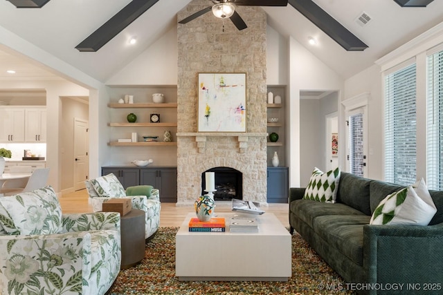 3908 S Elder Blvd, Broken Arrow, OK 74012 - living room featuring high vaulted ceiling, built in features, ceiling fan, a fireplace, and light wood-style floors