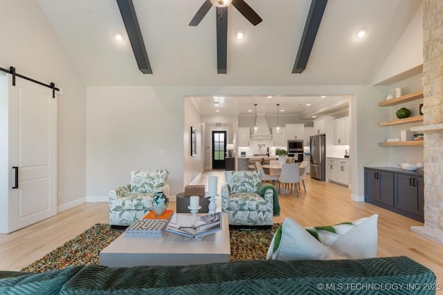 3908 S Elder Blvd, Broken Arrow, OK 74012 - living area featuring a barn door, light wood finished floors, a ceiling fan, high vaulted ceiling, and beam ceiling