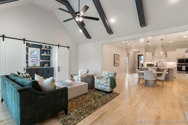 3908 S Elder Blvd, Broken Arrow, OK 74012 - living room with a barn door, high vaulted ceiling, a ceiling fan, recessed lighting, and light wood-type flooring