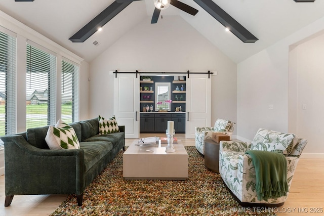 3908 S Elder Blvd, Broken Arrow, OK 74012 - living room with a barn door, high vaulted ceiling, light wood-style floors, beam ceiling, and ceiling fan