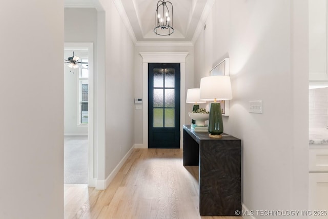 3908 S Elder Blvd, Broken Arrow, OK 74012 - foyer featuring light wood finished floors, ornamental molding, and a chandelier