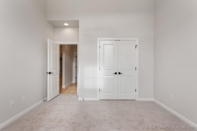 3908 S Elder Blvd, Broken Arrow, OK 74012 - unfurnished bedroom with light colored carpet, a closet, and recessed lighting