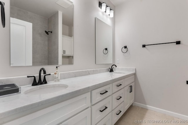 3908 S Elder Blvd, Broken Arrow, OK 74012 - bathroom featuring double vanity, tile patterned flooring, and tiled shower
