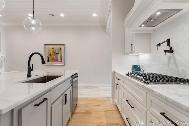 3908 S Elder Blvd, Broken Arrow, OK 74012 - kitchen featuring appliances with stainless steel finishes, exhaust hood, recessed lighting, tasteful backsplash, and light wood-style floors