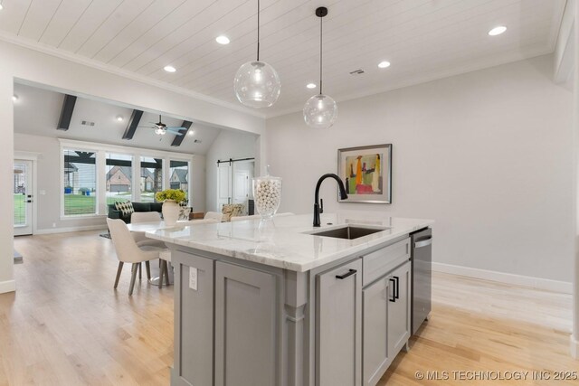3908 S Elder Blvd, Broken Arrow, OK 74012 - kitchen with open floor plan, stainless steel dishwasher, light wood-style flooring, gray cabinets, and a center island with sink