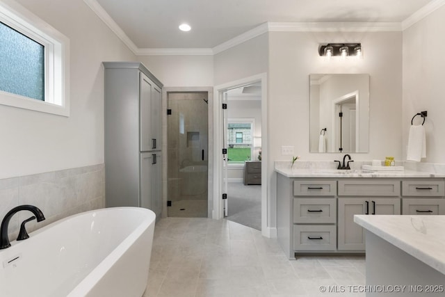 3908 S Elder Blvd, Broken Arrow, OK 74012 - bathroom featuring a stall shower, a soaking tub, vanity, tile patterned floors, and ornamental molding