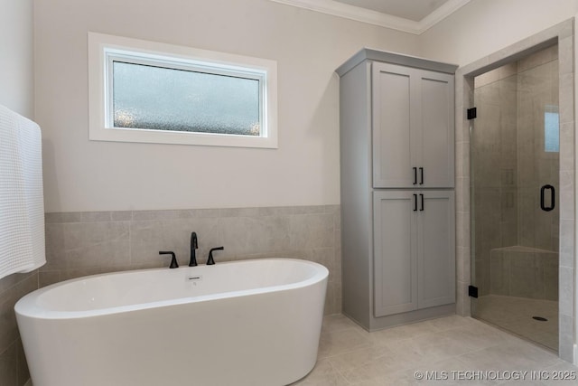 3908 S Elder Blvd, Broken Arrow, OK 74012 - full bathroom featuring a freestanding bath, a stall shower, crown molding, and tile patterned floors