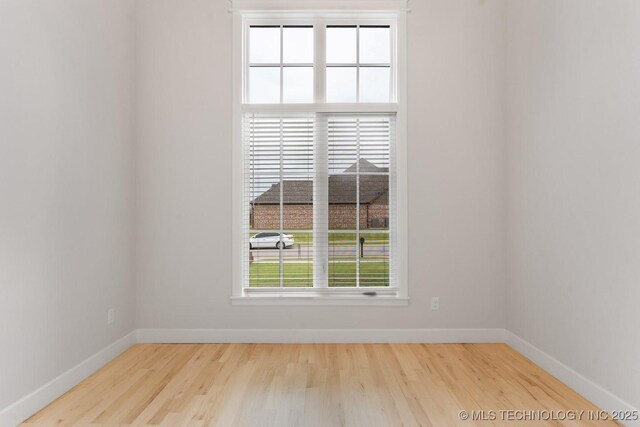 6617 S Fir Ave, Broken Arrow, OK 74134 - spare room with wood finished floors and baseboards