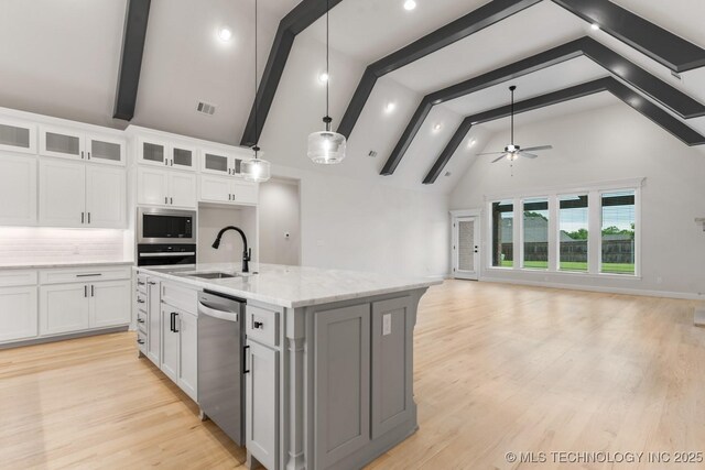6617 S Fir Ave, Broken Arrow, OK 74134 - kitchen with stainless steel appliances, a sink, high vaulted ceiling, beamed ceiling, and a ceiling fan