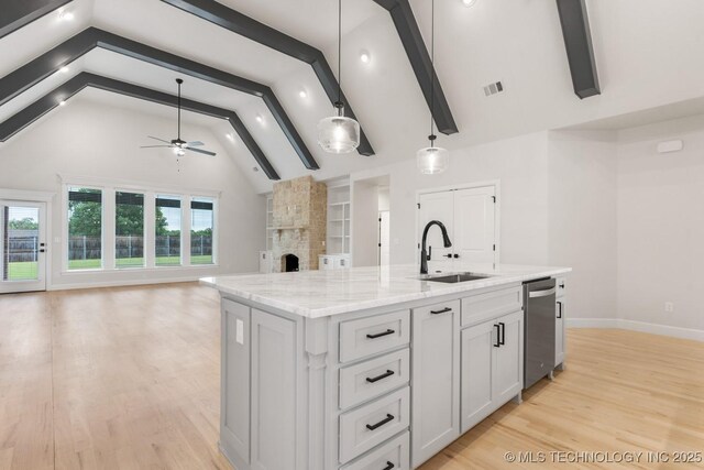 6617 S Fir Ave, Broken Arrow, OK 74134 - kitchen with a sink, stainless steel dishwasher, ceiling fan, light wood-style floors, and open floor plan
