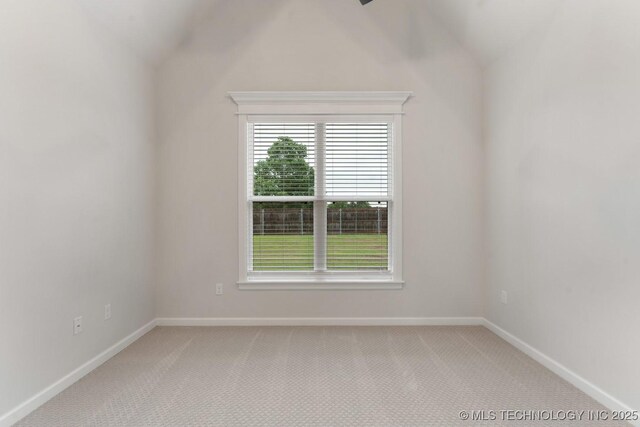 6617 S Fir Ave, Broken Arrow, OK 74134 - spare room with vaulted ceiling, light carpet, and baseboards
