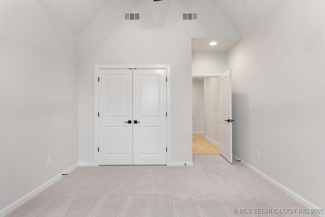 6617 S Fir Ave, Broken Arrow, OK 74134 - unfurnished bedroom with lofted ceiling, carpet, a closet, and baseboards