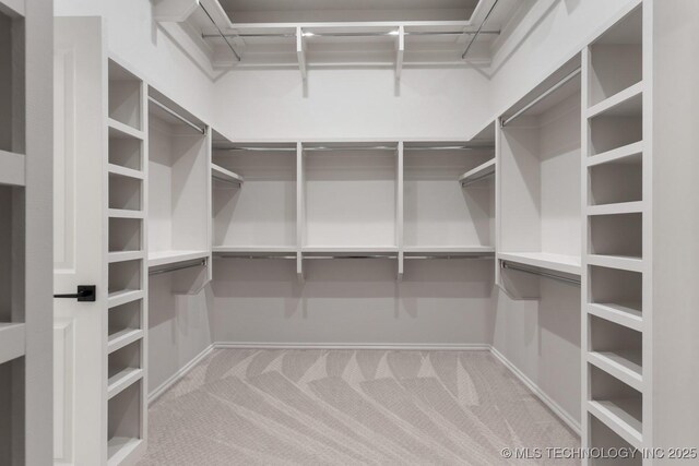 6617 S Fir Ave, Broken Arrow, OK 74134 - walk in closet featuring carpet floors