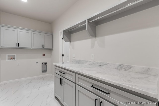 6617 S Fir Ave, Broken Arrow, OK 74134 - laundry area with hookup for an electric dryer, cabinet space, hookup for a washing machine, light marble finish floors, and baseboards