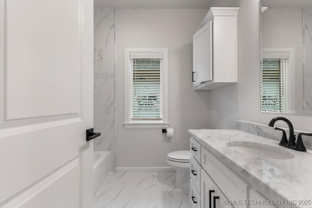 6617 S Fir Ave, Broken Arrow, OK 74134 - full bathroom featuring vanity, marble look tile flooring, toilet, baseboards, and washtub / shower combination
