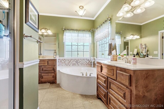 bathroom with vanity, ornamental molding, tile patterned floors, and a tub