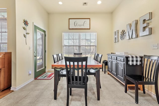 dining space with light tile patterned floors