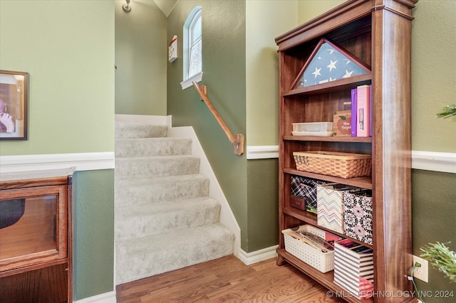 stairway with wood-type flooring