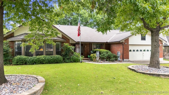 ranch-style home featuring a garage and a front lawn