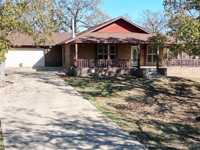 ranch-style home featuring a porch and a garage