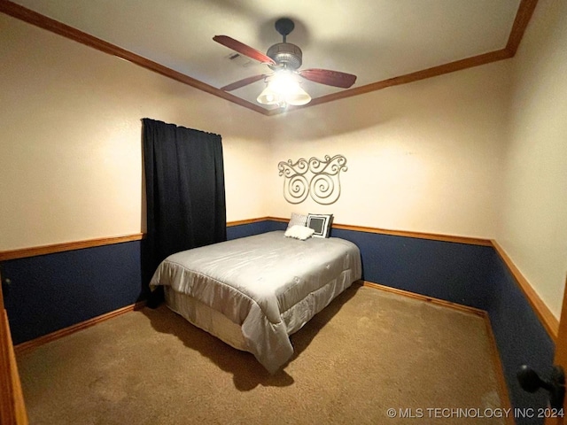 carpeted bedroom featuring ceiling fan and crown molding