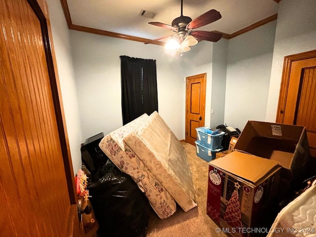 bedroom with carpet, ceiling fan, and ornamental molding