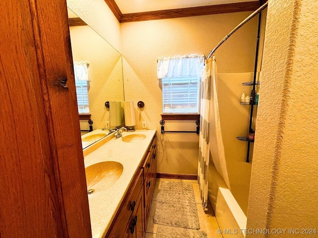 bathroom with vanity, shower / tub combo with curtain, and ornamental molding