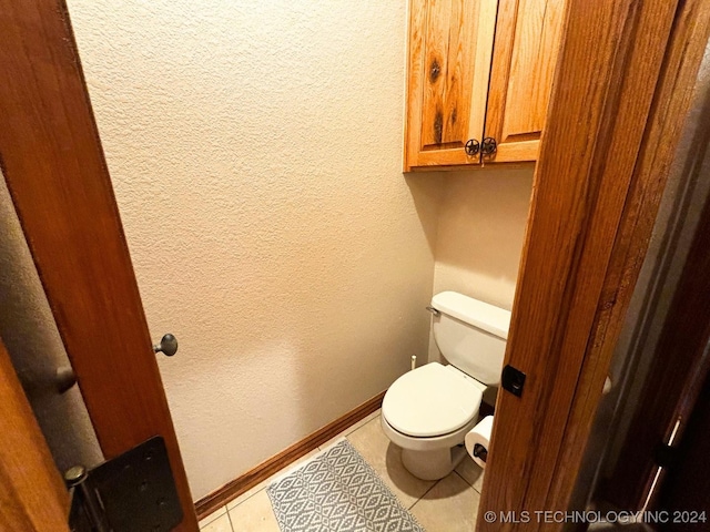 bathroom featuring tile patterned floors and toilet