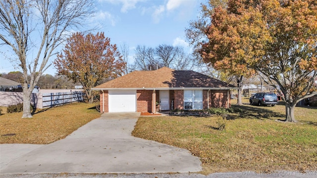 view of front facade with a front lawn and a garage