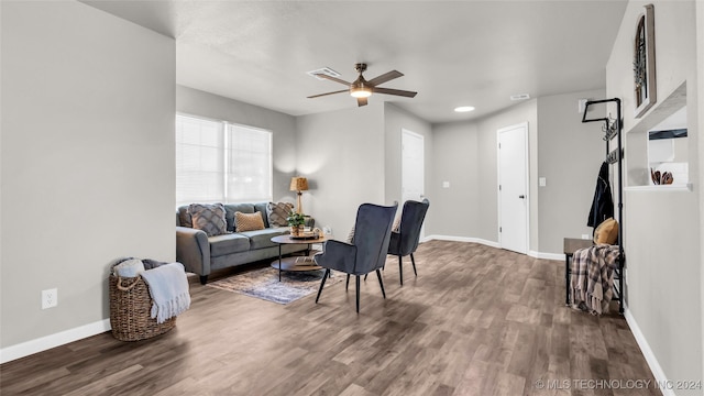 living room with hardwood / wood-style floors and ceiling fan