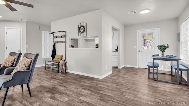 interior space with ceiling fan and hardwood / wood-style floors