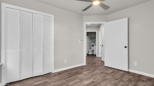 unfurnished bedroom with ceiling fan, a closet, and light hardwood / wood-style floors