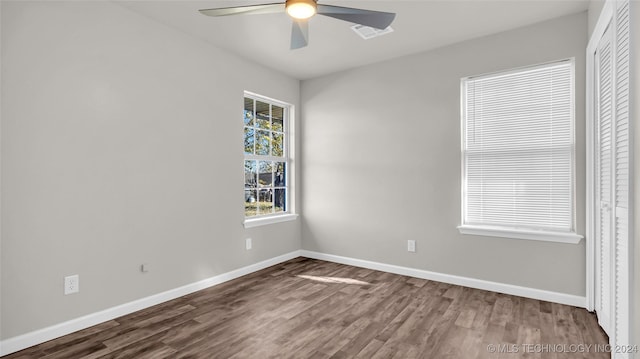 spare room featuring ceiling fan and hardwood / wood-style flooring