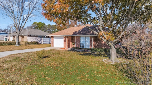 single story home with a front yard and a garage