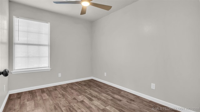 empty room featuring ceiling fan and hardwood / wood-style flooring