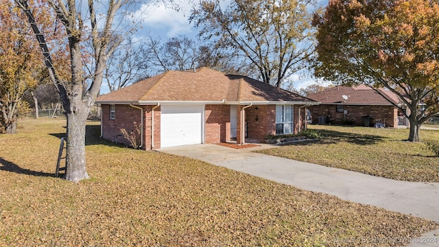 single story home with a garage and a front yard