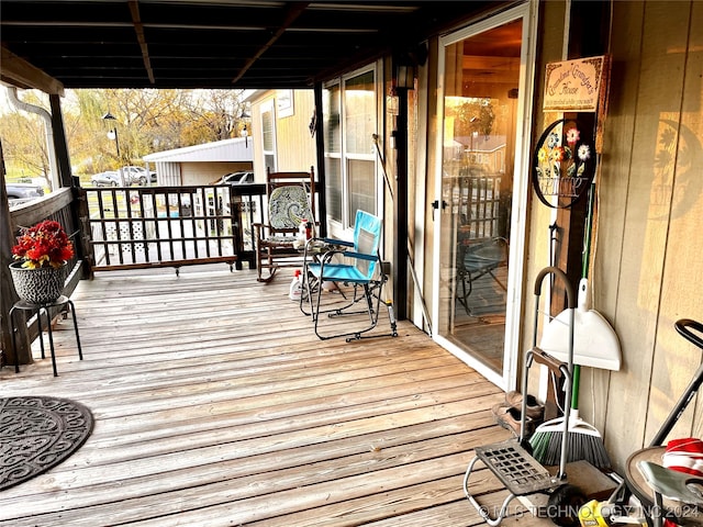 wooden terrace featuring a porch