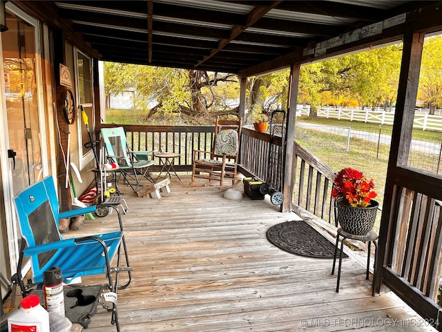 wooden terrace featuring a porch