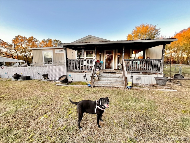 view of front of home featuring a front lawn and a porch