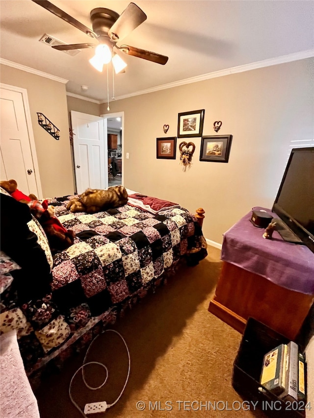 carpeted bedroom with ceiling fan and crown molding